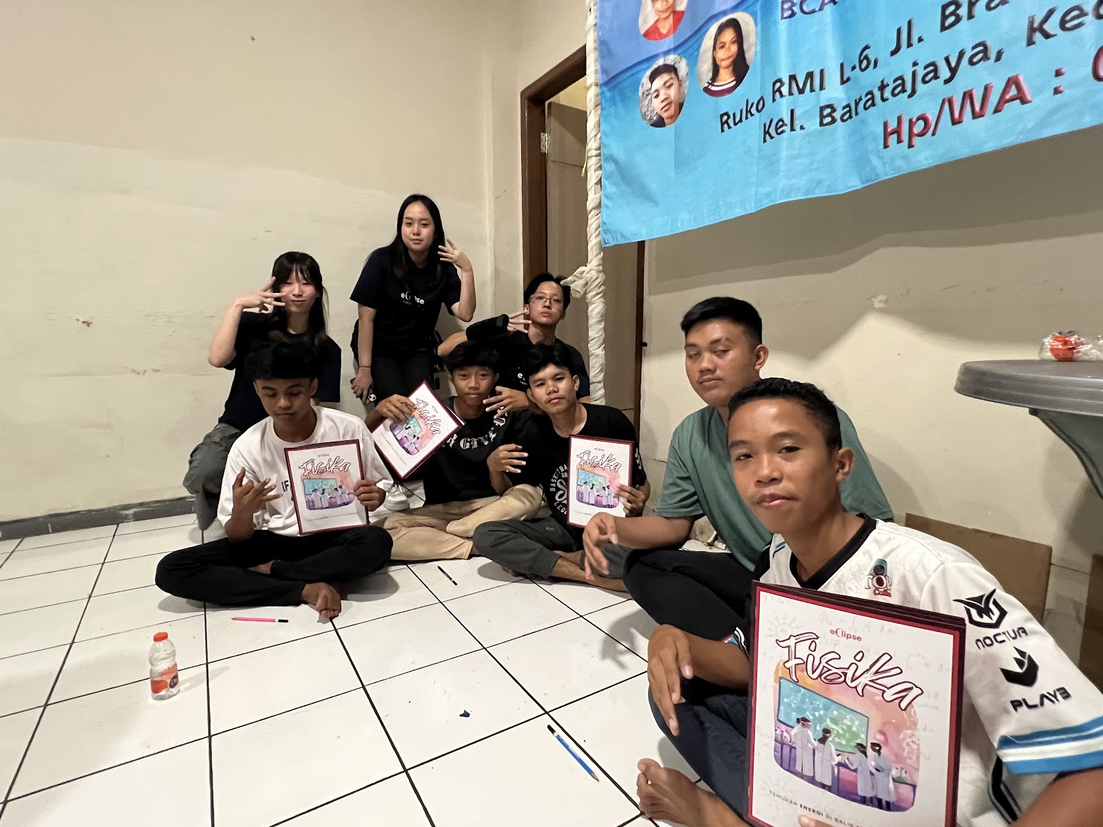 Participants showing their illustrated learning books