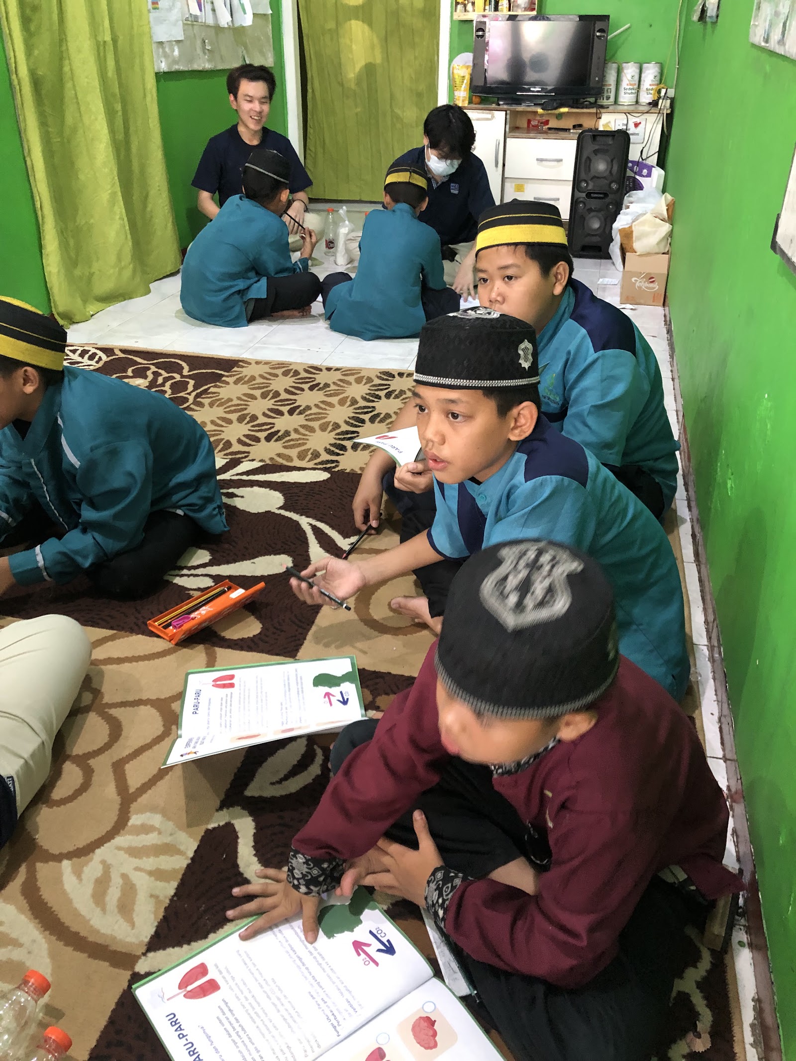 A small group exploring illustrated learning materials